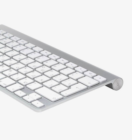 Clavier tactile sans fil pour ordinateur et tablettes, design moderne et compact, en noir avec touches tactiles.
